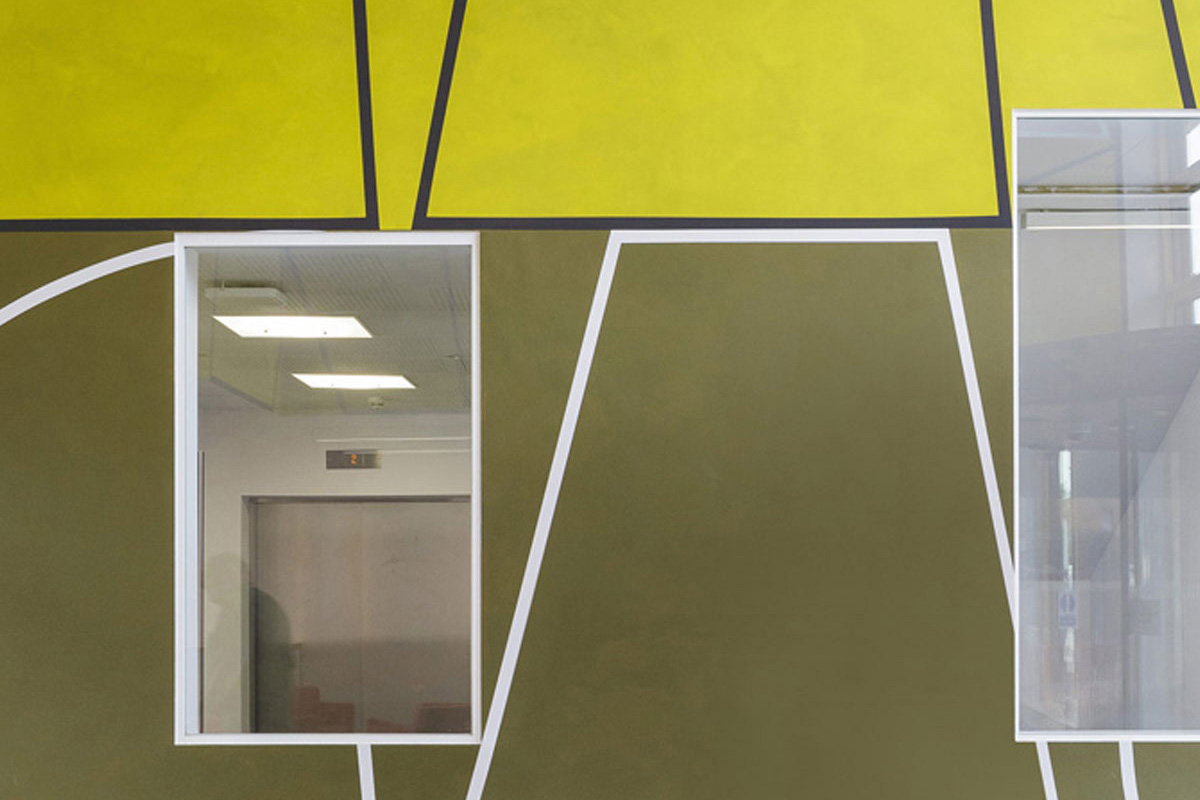 A colourful installation spans hospital floors, helping with wayfinding across the site.
